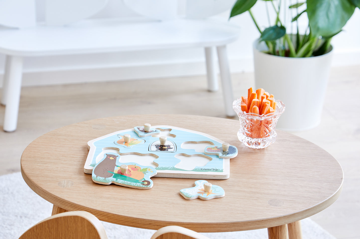 peg  wooden puzzle with soft illustrations from wood animals in a kids bedroom