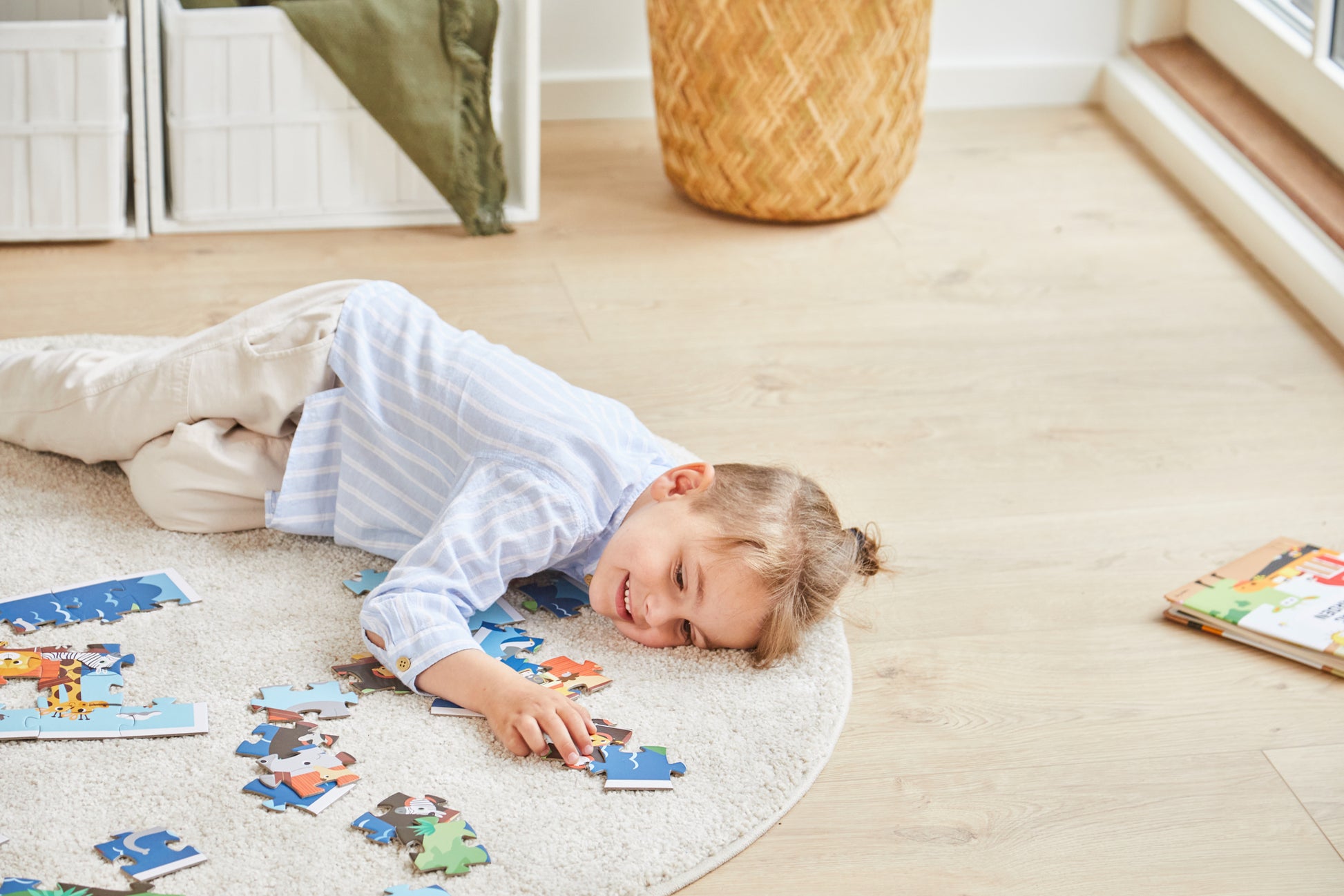 boy playing with noah´s ark puzzle game