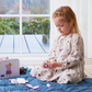 girl playing with peppa pig beauty set suitcase