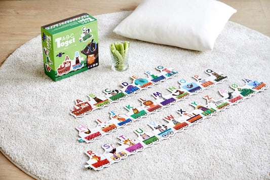a b c toget box game with puzzle pieces in a kids bedroom