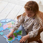 Girl playing with Peppa Pig family deco puzzle