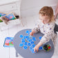 girl playing with peppa pig memory game 